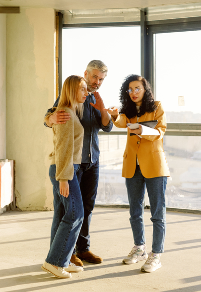 People talking to real estate agent