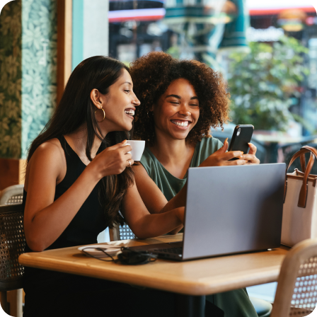 Two women looking at phone