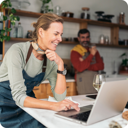 Woman smiling while using laptop